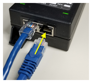 ethernet cables plugging into P O E device